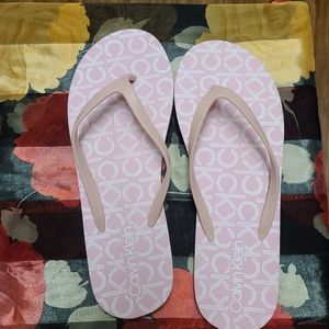 Pink Calvin Klein flip flops